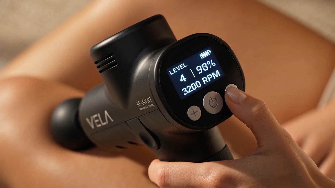 VELA product film: a hand works the massage gun.